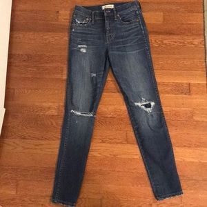 lightly distressed dark wash Madewell jeans